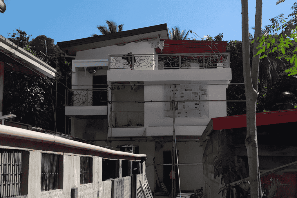 Paint Materials Approval Board showing the exterior elevation of the Payot–Nabas Residence in Malitbog, highlighting approved wall colors, balcony finishes, and final paint application zones.